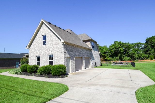 216 Honeysuckle Ln, Lebanon, TN 37087 - view of home's exterior with driveway, brick siding, and a shingled roof