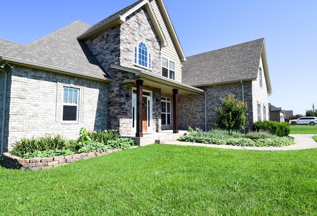 216 Honeysuckle Ln, Lebanon, TN 37087 - view of front of home featuring a shingled roof, a front lawn, and brick siding