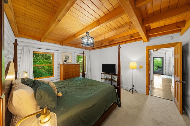945 Scenic Trl, Gatlinburg, TN 37738 - bedroom with a wooden ceiling with exposed beams, light carpet, and a chandelier