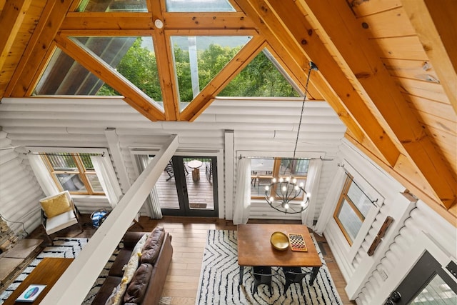 945 Scenic Trl, Gatlinburg, TN 37738 - living room with high vaulted ceiling, hardwood / wood-style floors, and a chandelier