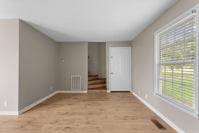 309 Shawnee Dr, Columbia, TN 38401 - unfurnished room with light wood finished floors and stairs