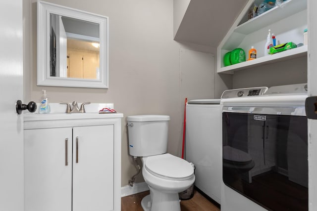 309 Shawnee Dr, Columbia, TN 38401 - half bath featuring washer and dryer, vanity, and wood finished floors