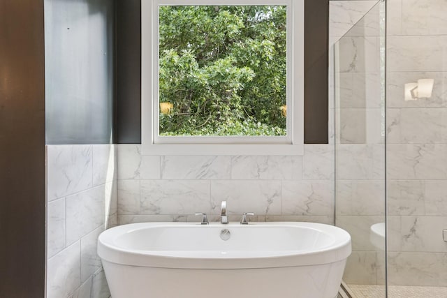 1605 Stokes Ln Unit A, Nashville, TN 37215 - full bath featuring a freestanding bath, plenty of natural light, and tile walls