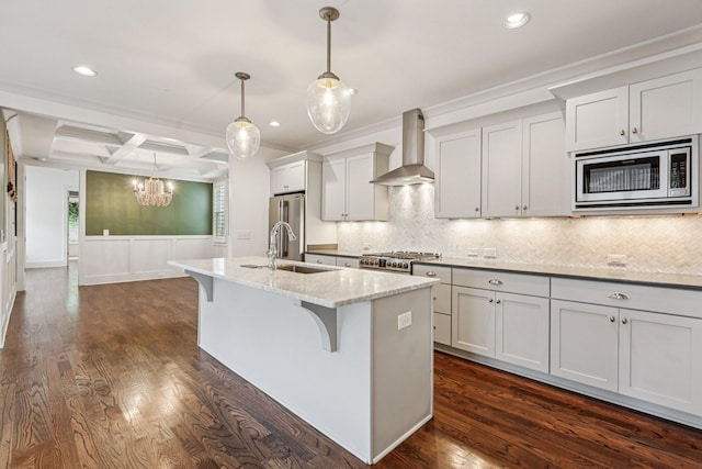 1605 Stokes Ln Unit A, Nashville, TN 37215 - kitchen with stainless steel appliances, wall chimney range hood, an island with sink, a chandelier, and a kitchen bar