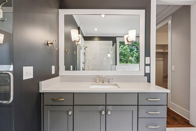 1605 Stokes Ln Unit A, Nashville, TN 37215 - bathroom with a shower stall, vanity, wood finished floors, and ornamental molding