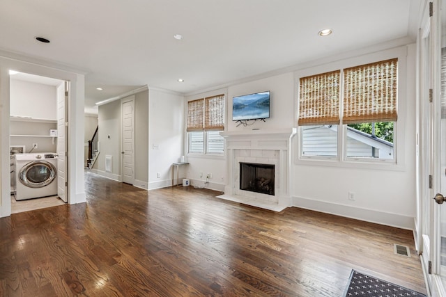 1605 Stokes Ln Unit A, Nashville, TN 37215 - unfurnished living room featuring washer / dryer, a tile fireplace, plenty of natural light, stairs, and recessed lighting