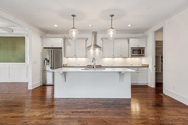 1605 Stokes Ln Unit A, Nashville, TN 37215 - kitchen with stainless steel appliances, wall chimney exhaust hood, a breakfast bar area, a kitchen island with sink, and tasteful backsplash