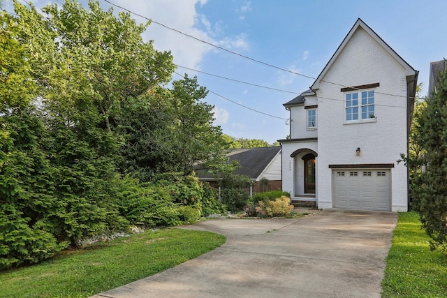 1605 Stokes Ln Unit A, Nashville, TN 37215 - traditional-style house with brick siding, a garage, and driveway