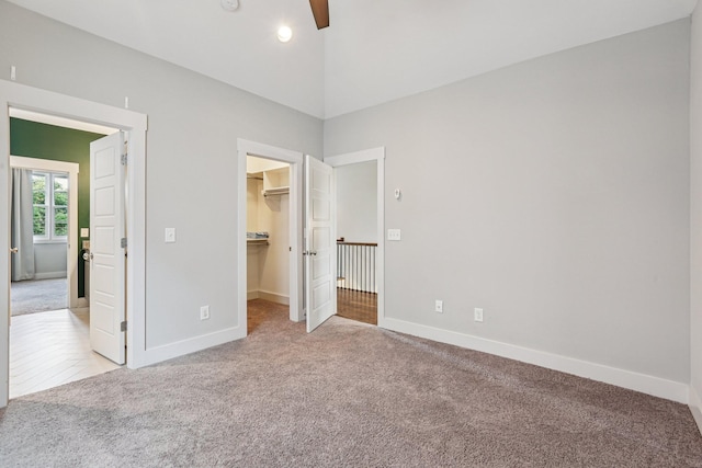 1605 Stokes Ln Unit A, Nashville, TN 37215 - unfurnished bedroom featuring carpet floors, a walk in closet, a ceiling fan, a closet, and high vaulted ceiling