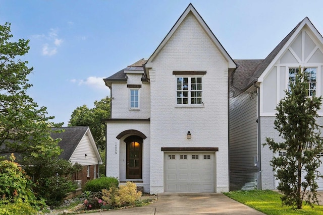 1605 Stokes Ln Unit A, Nashville, TN 37215 - french country inspired facade featuring a garage, brick siding, and driveway