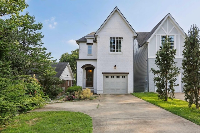 1605 Stokes Ln Unit A, Nashville, TN 37215 - french country inspired facade featuring driveway, brick siding, and an attached garage