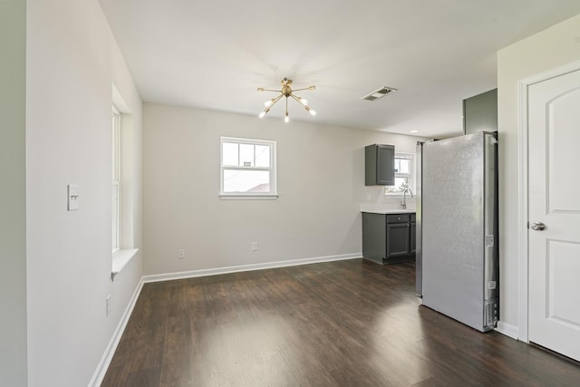 3136 Lauren Evelyn Way, Nashville, TN 37207 - unfurnished living room featuring a chandelier and dark wood-type flooring