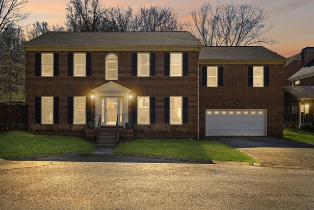 405 Wexford Ct, Franklin, TN 37069 - colonial home with asphalt driveway, a garage, brick siding, and roof with shingles