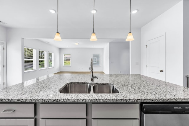 1234 English Oak Dr, Clarksville, TN 37043 - kitchen with gray cabinets, dishwasher, open floor plan, light stone counters, and recessed lighting