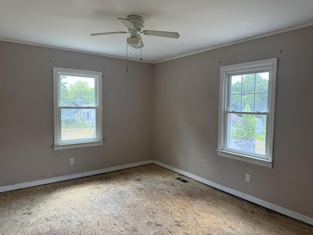 9843 Ed Lyell Rd, Lyles, TN 37098 - empty room with healthy amount of natural light, ornamental molding, and ceiling fan