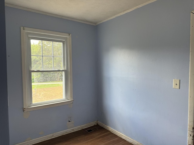 9843 Ed Lyell Rd, Lyles, TN 37098 - unfurnished room with dark wood-style flooring and crown molding
