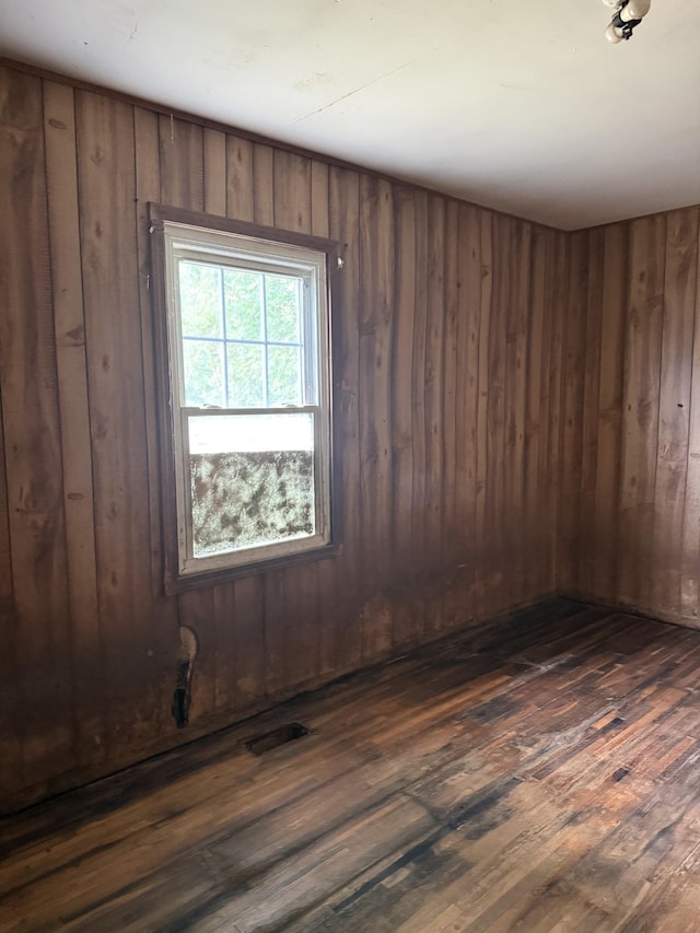 9843 Ed Lyell Rd, Lyles, TN 37098 - empty room with dark wood-style floors and wooden walls
