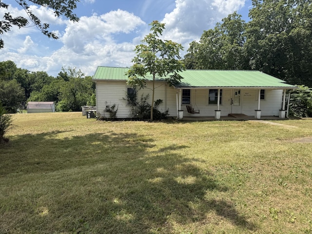 9843 Ed Lyell Rd, Lyles, TN 37098 - view of front of property with a front lawn, a metal roof, and a porch