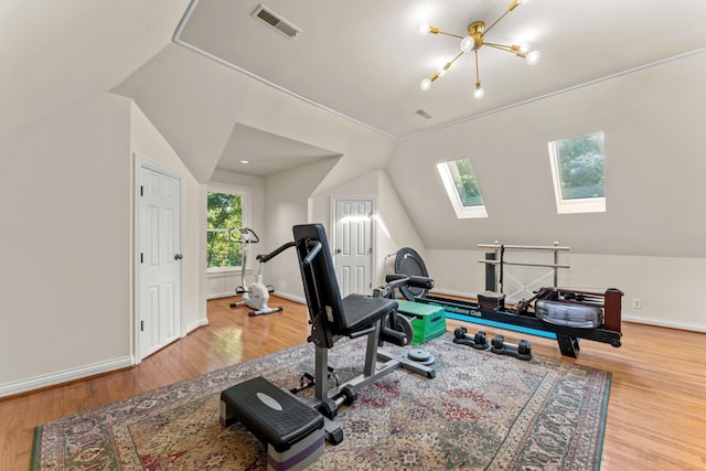 162 N Berwick Ln, Franklin, TN 37069 - workout area featuring lofted ceiling, a skylight, wood finished floors, and a chandelier