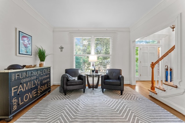 162 N Berwick Ln, Franklin, TN 37069 - living area with wood finished floors, ornamental molding, and stairway