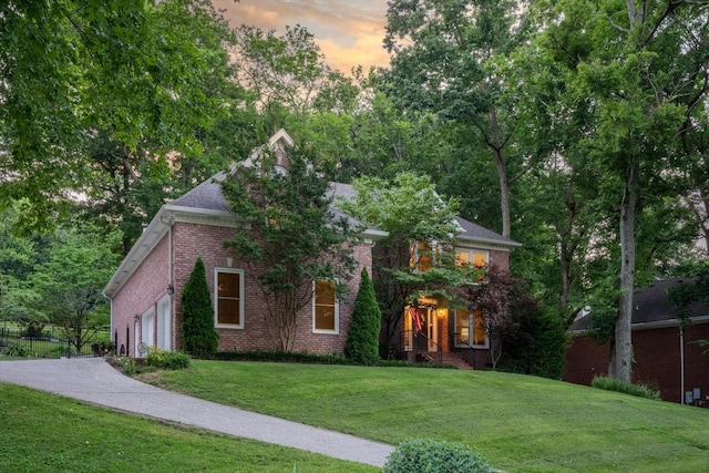 162 N Berwick Ln, Franklin, TN 37069 - view of front of home with brick siding, a lawn, and driveway