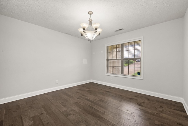 3158 Whitetail Dr, Clarksville, TN 37043 - empty room featuring a chandelier, dark wood-type flooring, and a textured ceiling