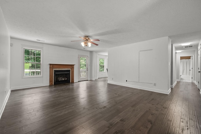 3158 Whitetail Dr, Clarksville, TN 37043 - unfurnished living room featuring a textured ceiling, a ceiling fan, dark wood-style flooring, and a fireplace