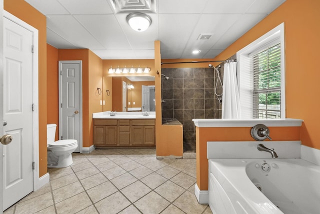 3158 Whitetail Dr, Clarksville, TN 37043 - bathroom featuring a tile shower, a bath, double vanity, and tile patterned flooring