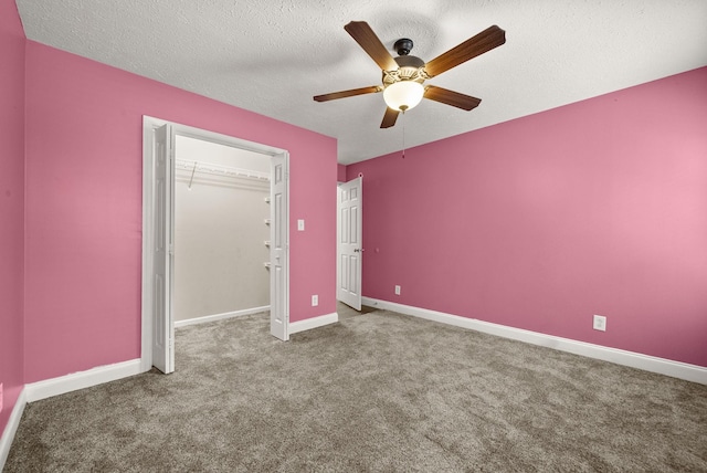 3158 Whitetail Dr, Clarksville, TN 37043 - unfurnished bedroom featuring carpet flooring, a closet, a textured ceiling, and a ceiling fan