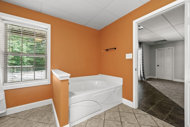 3158 Whitetail Dr, Clarksville, TN 37043 - bathroom featuring a drop ceiling, a garden tub, and healthy amount of natural light
