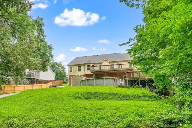 3158 Whitetail Dr, Clarksville, TN 37043 - rear view of house with a wooden deck and brick siding
