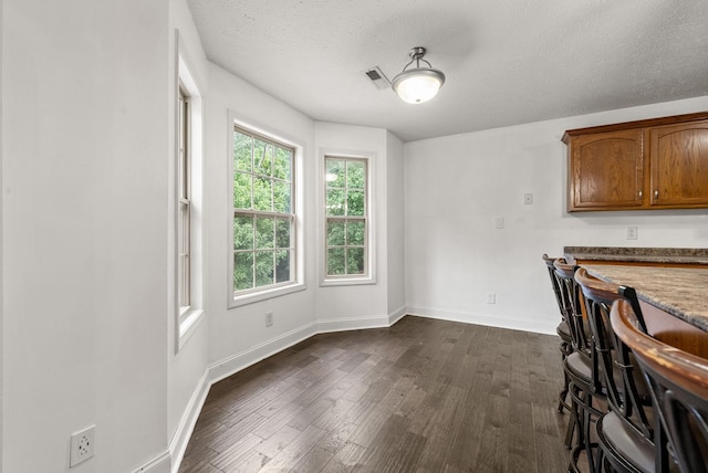3158 Whitetail Dr, Clarksville, TN 37043 - dining room featuring dark wood-type flooring and a textured ceiling