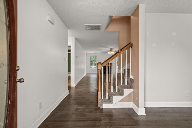 3158 Whitetail Dr, Clarksville, TN 37043 - foyer entrance with a textured ceiling, dark wood-style floors, ceiling fan, and stairs