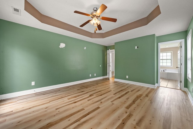 3158 Whitetail Dr, Clarksville, TN 37043 - spare room with a ceiling fan, wood finished floors, and a raised ceiling