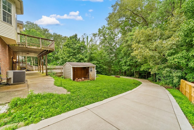 3158 Whitetail Dr, Clarksville, TN 37043 - view of yard featuring a storage shed, stairway, a wooden deck, a patio, and view of scattered trees