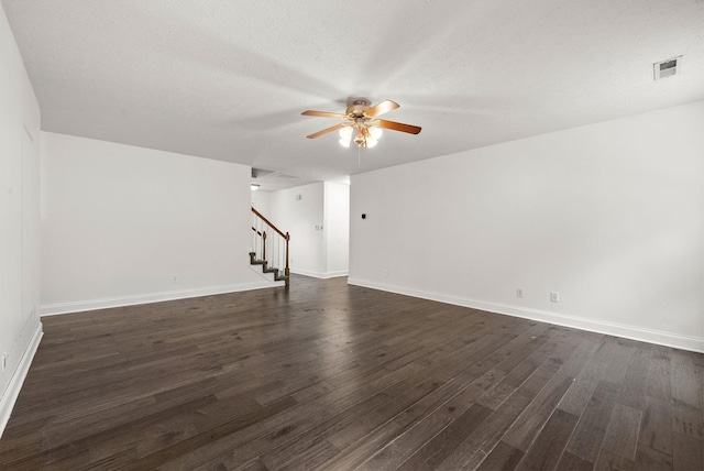 3158 Whitetail Dr, Clarksville, TN 37043 - unfurnished living room featuring ceiling fan, stairway, dark wood-style flooring, and a textured ceiling