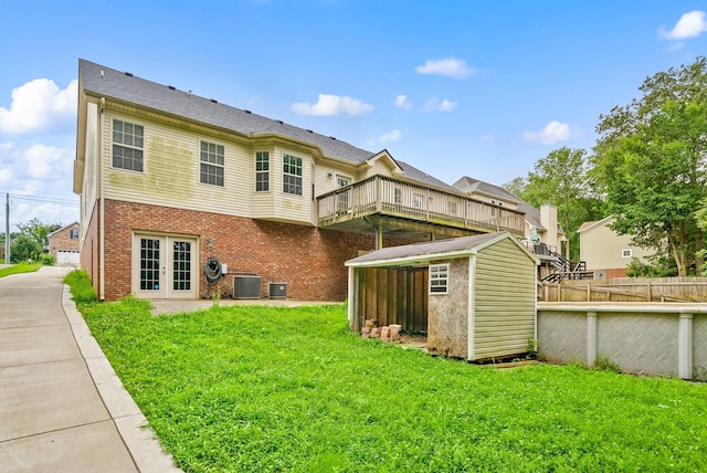 3158 Whitetail Dr, Clarksville, TN 37043 - back of property featuring french doors, a storage shed, brick siding, and a wooden deck