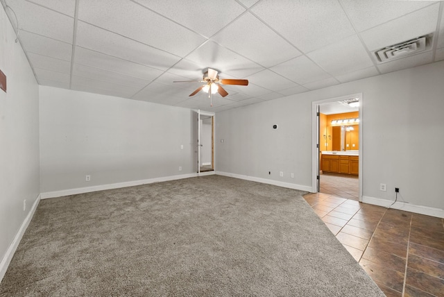 3158 Whitetail Dr, Clarksville, TN 37043 - tiled spare room with ceiling fan, a paneled ceiling, and carpet flooring
