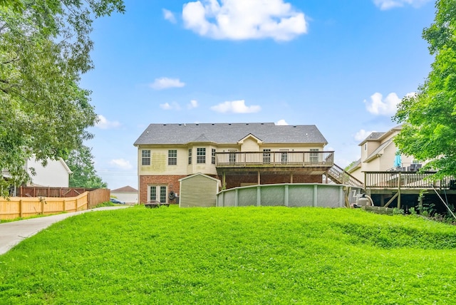 3158 Whitetail Dr, Clarksville, TN 37043 - rear view of house with a wooden deck and brick siding