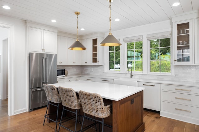 928 Harbor Pointe Dr, Silver Point, TN 38582 - kitchen with high end fridge, wooden ceiling, healthy amount of natural light, recessed lighting, and white cabinets