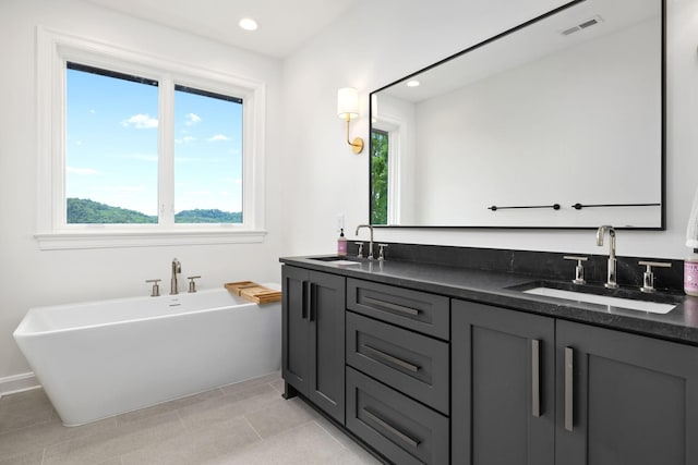 928 Harbor Pointe Dr, Silver Point, TN 38582 - bathroom featuring plenty of natural light, double vanity, a soaking tub, recessed lighting, and tile patterned floors