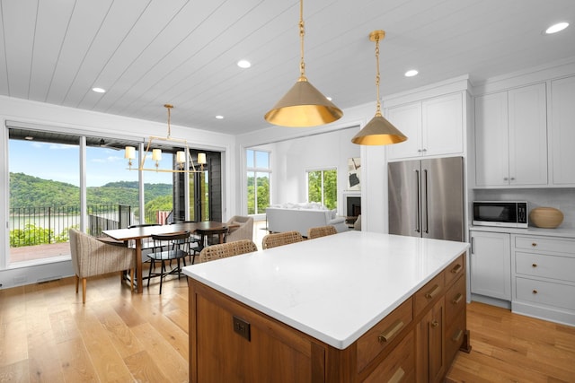 928 Harbor Pointe Dr, Silver Point, TN 38582 - kitchen featuring high end refrigerator, light wood-style floors, recessed lighting, a kitchen island, and light countertops