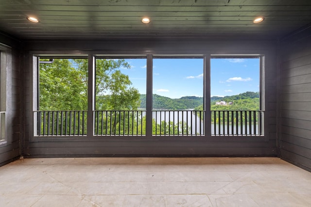 928 Harbor Pointe Dr, Silver Point, TN 38582 - unfurnished sunroom with healthy amount of natural light and a water view