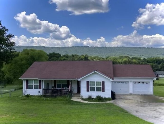 191 Lookout Cir, Trenton, GA 30752 - ranch-style house with covered porch, a garage, concrete driveway, and a front lawn