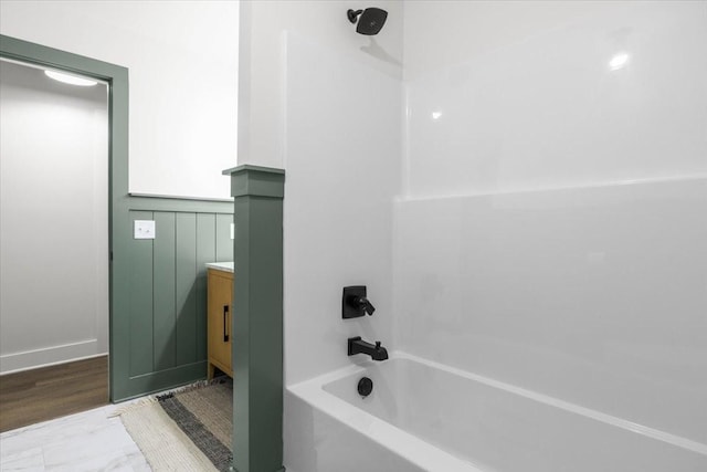 1122 Ridgecrest Dr, Dickson, TN 37055 - full bathroom with bathing tub / shower combination, vanity, and a wainscoted wall