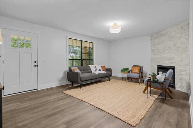 1122 Ridgecrest Dr, Dickson, TN 37055 - living room featuring wood finished floors, healthy amount of natural light, and a fireplace