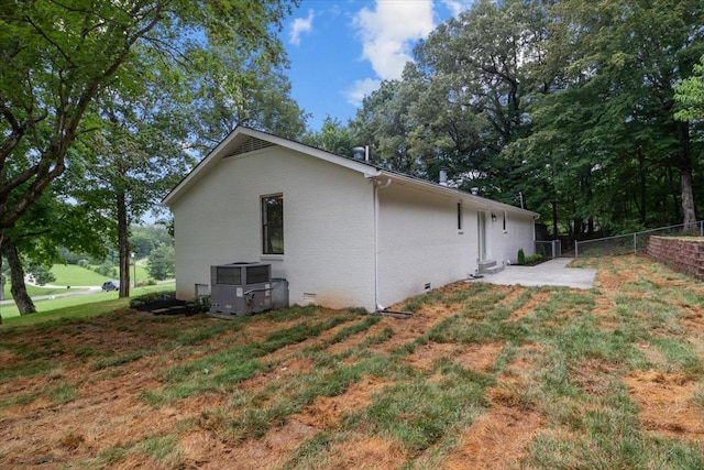 1122 Ridgecrest Dr, Dickson, TN 37055 - view of property exterior featuring crawl space and a central AC unit