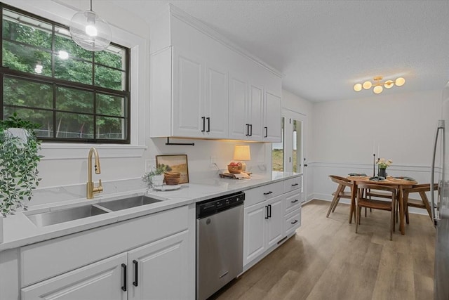 1122 Ridgecrest Dr, Dickson, TN 37055 - kitchen with dishwasher, light wood-type flooring, white cabinetry, a textured ceiling, and hanging light fixtures
