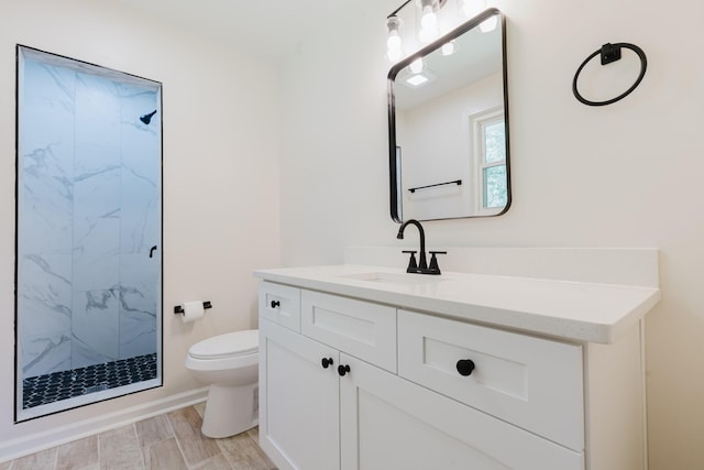 143 Bishop Ln, Burns, TN 37029 - bathroom with a marble finish shower, vanity, and wood finished floors