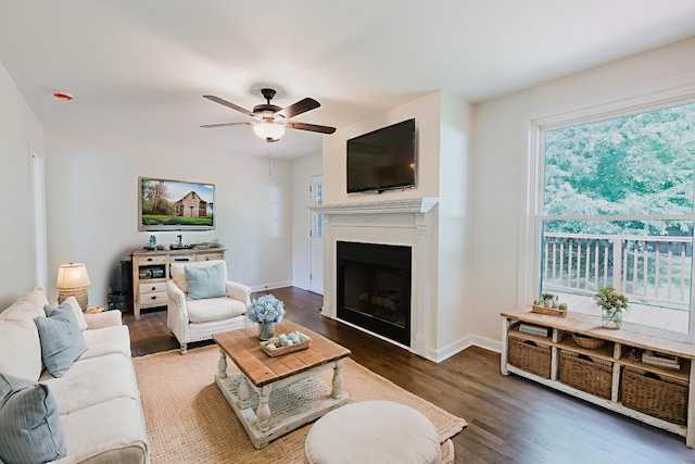 143 Bishop Ln, Burns, TN 37029 - living area with ceiling fan, wood finished floors, and a fireplace